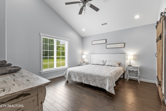 2738 Indian Creek Rd, Dandridge, TN 37725 - bedroom featuring visible vents, baseboards, high vaulted ceiling, dark wood-type flooring, and a barn door