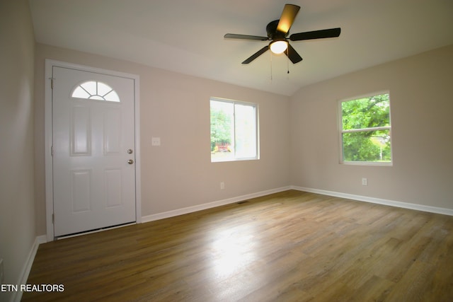 entryway with baseboards, a ceiling fan, and wood finished floors
