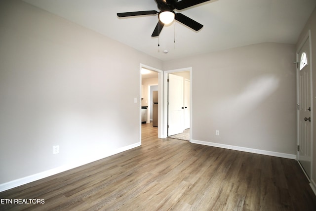 unfurnished bedroom featuring baseboards, a ceiling fan, and wood finished floors