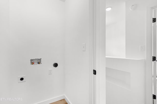 laundry area featuring baseboards, hookup for a washing machine, light wood-style floors, hookup for an electric dryer, and laundry area