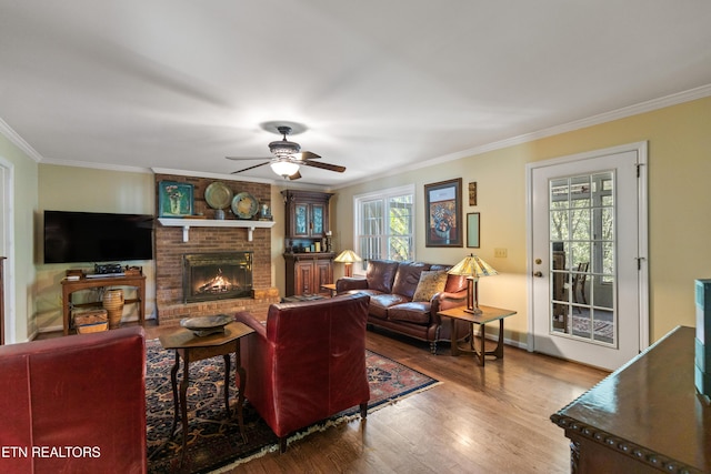 2227 Bay Pointe Dr, Hixson, TN 37343 - living area featuring ornamental molding, wood finished floors, a fireplace, baseboards, and a ceiling fan