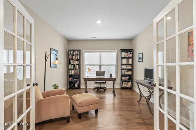 office area with baseboards, dark wood-style flooring, a healthy amount of sunlight, and french doors