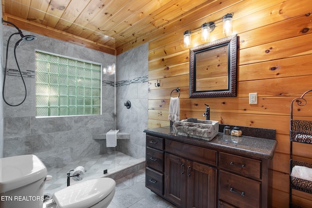 2471 Cove Mountain Ln, Sevierville, TN 37862 - bathroom with vanity, wood ceiling, a tile shower, and toilet