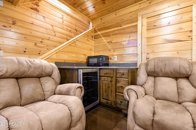 2471 Cove Mountain Ln, Sevierville, TN 37862 - sitting room featuring wooden walls, wooden ceiling, dark wood finished floors, and beverage cooler