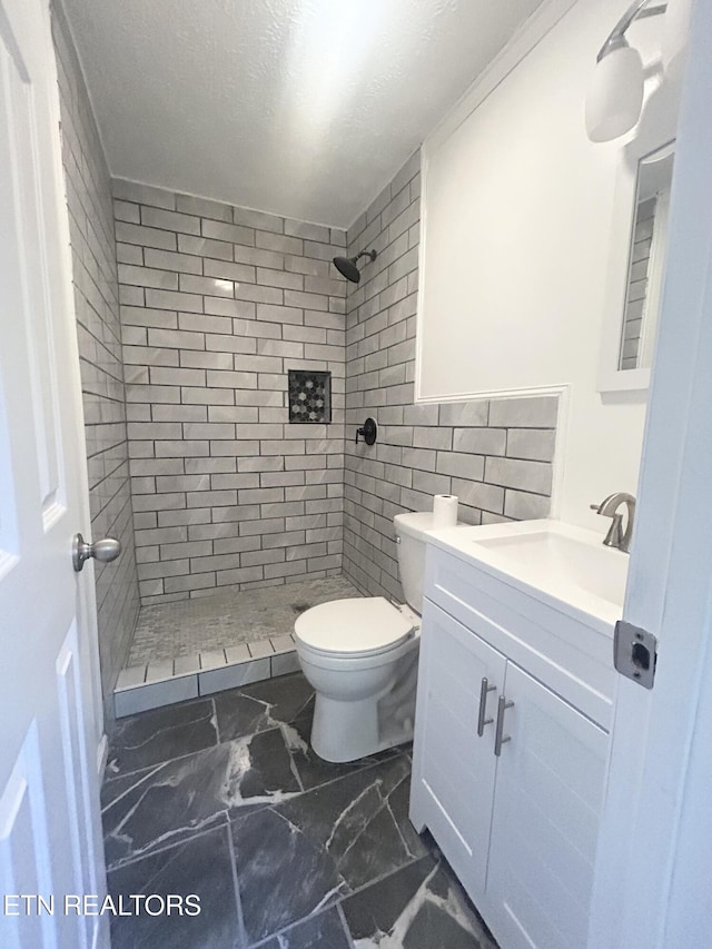 526 S Castle St, Knoxville, TN 37914 - bathroom with vanity, marble finish floor, toilet, and a shower stall