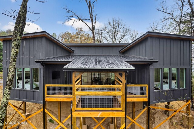 - Chinquapin Drive, Sevierville, TN 37876 - back of property featuring board and batten siding, metal roof, and a wooden deck