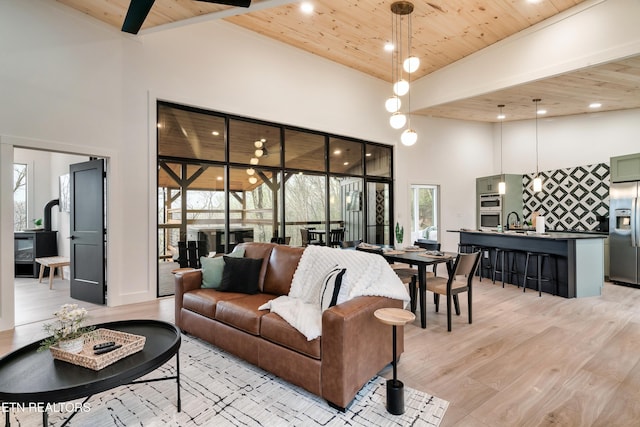- Chinquapin Drive, Sevierville, TN 37876 - living room featuring a towering ceiling, recessed lighting, wood ceiling, and light wood-style floors