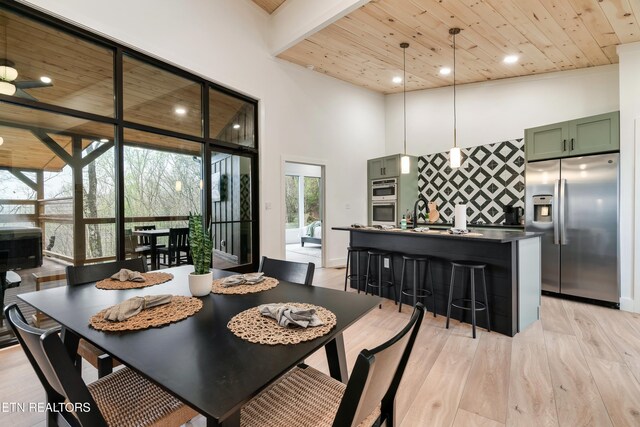 - Chinquapin Drive, Sevierville, TN 37876 - dining space with wooden ceiling, a high ceiling, light wood finished floors, and recessed lighting