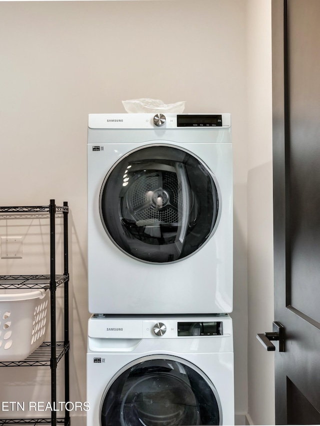 - Chinquapin Drive, Sevierville, TN 37876 - clothes washing area featuring laundry area and stacked washing maching and dryer
