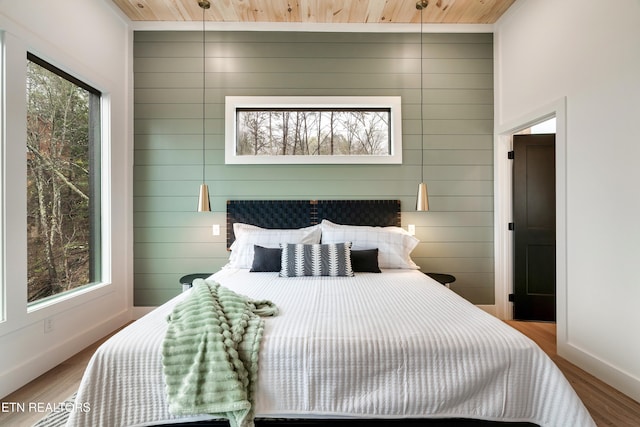 - Chinquapin Drive, Sevierville, TN 37876 - bedroom featuring baseboards, wood ceiling, and wood finished floors