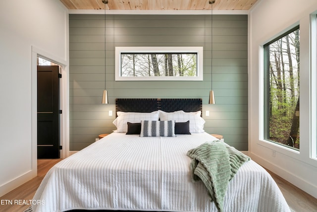 - Chinquapin Drive, Sevierville, TN 37876 - bedroom with baseboards, wooden ceiling, and wood finished floors