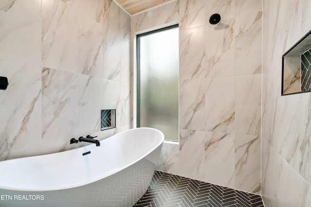 - Chinquapin Drive, Sevierville, TN 37876 - bathroom featuring a soaking tub, tiled shower, and tile walls