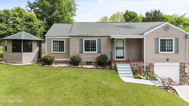 ranch-style house with a garage, a front lawn, and driveway