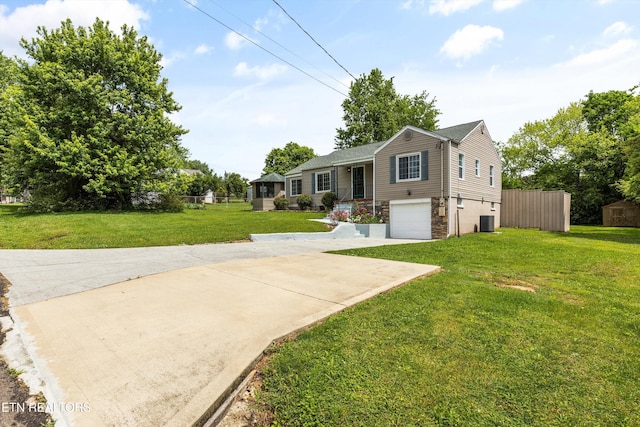 view of front of home featuring stone siding, a garage, central AC, concrete driveway, and a front yard