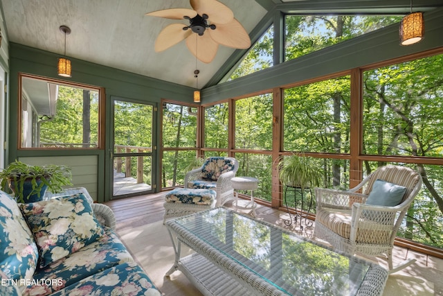 sunroom / solarium with a ceiling fan, lofted ceiling, and an outdoor hangout area
