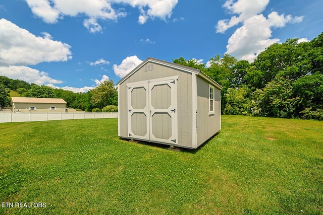 view of shed with view of wooded area