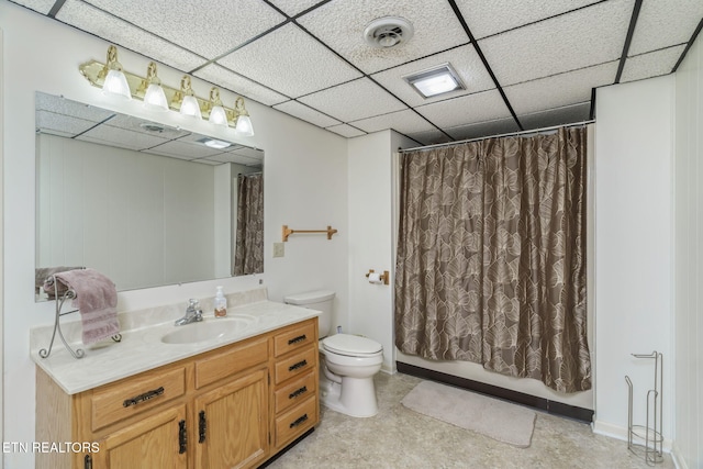 bathroom with vanity, visible vents, toilet, a drop ceiling, and shower / bath combo