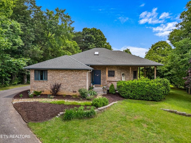 1819 Big Buck Ln, Sevierville, TN 37876 - view of front of home with brick siding, a front yard, roof with shingles, and crawl space