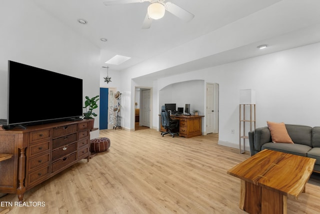 1819 Big Buck Ln, Sevierville, TN 37876 - living room featuring a desk, light wood finished floors, a skylight, baseboards, and ceiling fan