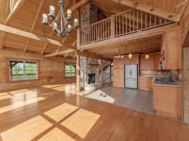 155 George Thomas Rd, Vonore, TN 37885 - unfurnished living room with wood ceiling, a chandelier, a sink, and dark wood-style floors