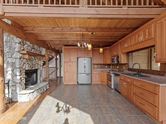 155 George Thomas Rd, Vonore, TN 37885 - kitchen with a sink, beam ceiling, appliances with stainless steel finishes, a notable chandelier, and wooden ceiling