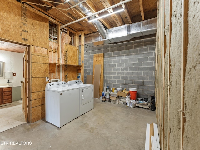 155 George Thomas Rd, Vonore, TN 37885 - clothes washing area featuring laundry area, concrete block wall, and washer and dryer