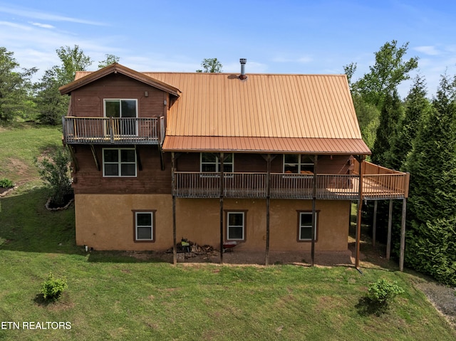 155 George Thomas Rd, Vonore, TN 37885 - rear view of property with stucco siding, metal roof, and a lawn