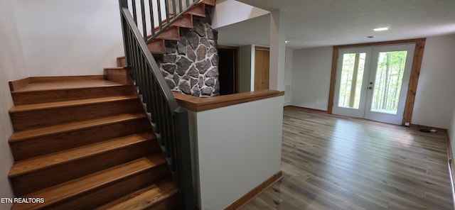 2165 Street Place Loop, Monterey, TN 38574 - stairway featuring baseboards, wood finished floors, and french doors