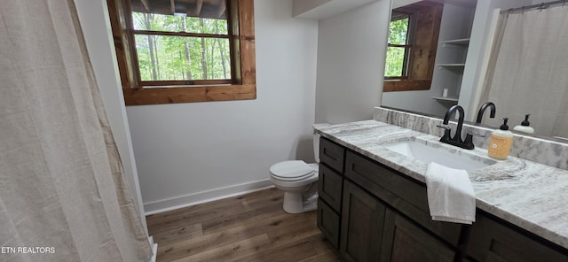 2165 Street Place Loop, Monterey, TN 38574 - full bathroom featuring wood finished floors, toilet, baseboards, and vanity