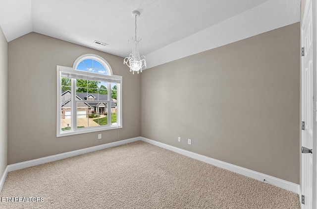 carpeted empty room with an inviting chandelier, baseboards, visible vents, and lofted ceiling