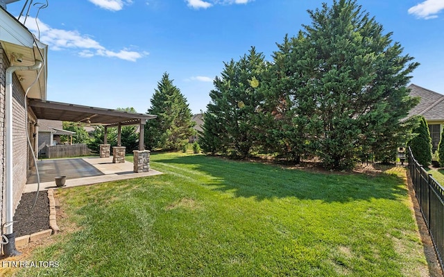 view of yard featuring a patio and a fenced backyard