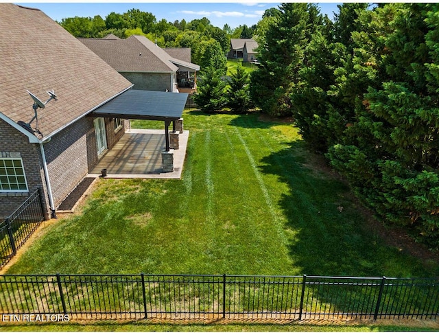 view of yard featuring a fenced backyard and a patio area