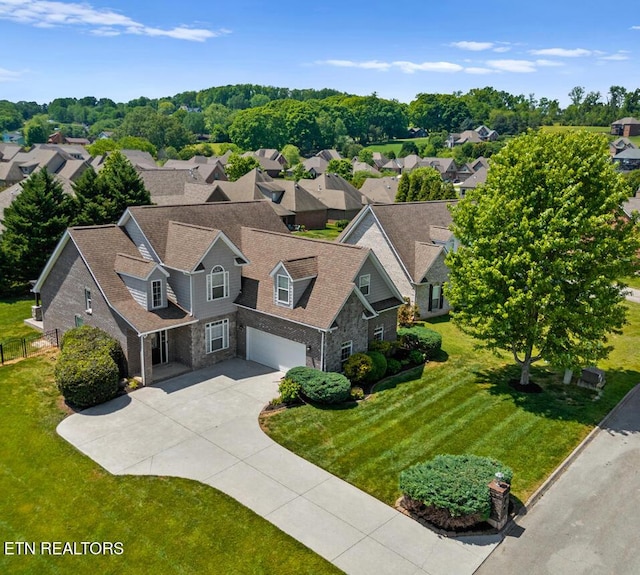 birds eye view of property with a residential view