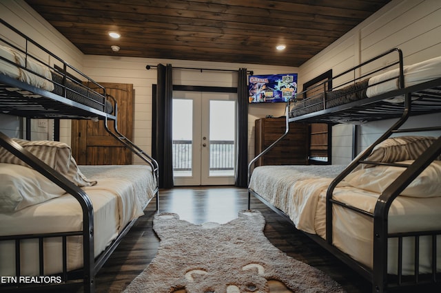bedroom with access to outside, french doors, wooden ceiling, and wood finished floors