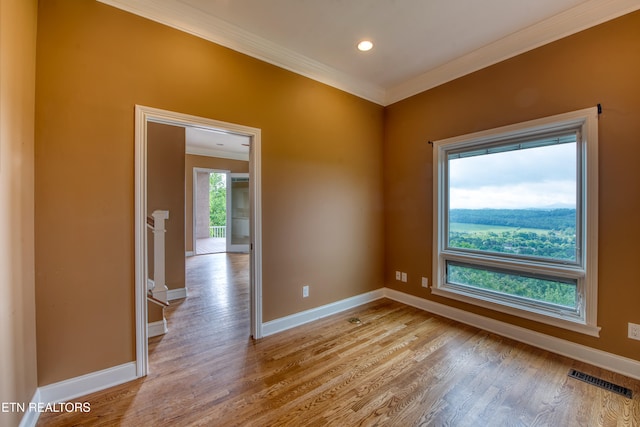 1012 Falcon Crest Dr, Seymour, TN 37865 - unfurnished room featuring ornamental molding, baseboards, light wood-type flooring, and visible vents