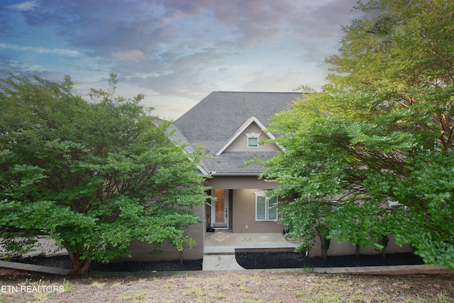 1012 Falcon Crest Dr, Seymour, TN 37865 - view of front of home with a porch, roof with shingles, and stucco siding