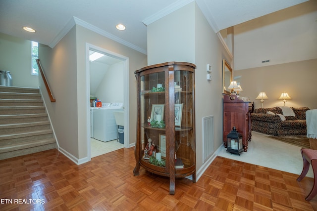 corridor with washer / clothes dryer, stairs, ornamental molding, visible vents, and baseboards