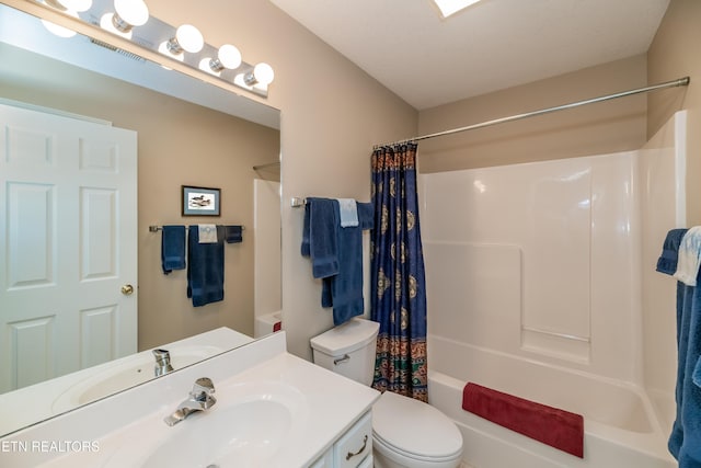 bathroom featuring vanity, toilet, and shower / bathtub combination with curtain