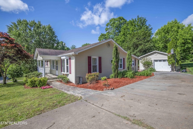 941 Pine Top St, Lenoir City, TN 37772 - ranch-style house featuring roof with shingles, a porch, a front yard, an outbuilding, and concrete driveway