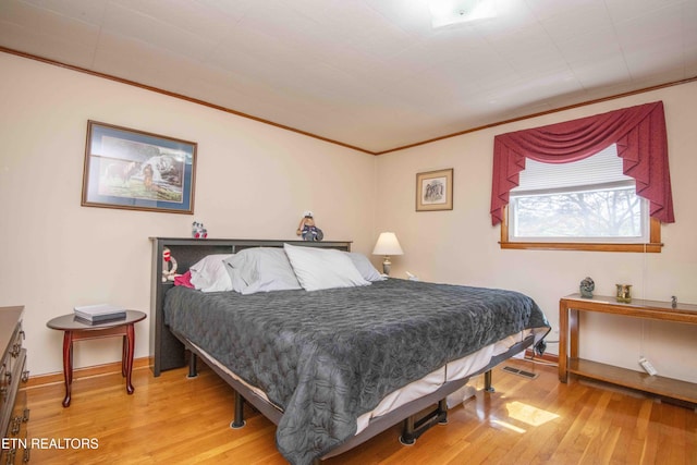 941 Pine Top St, Lenoir City, TN 37772 - bedroom with baseboards, ornamental molding, and wood finished floors