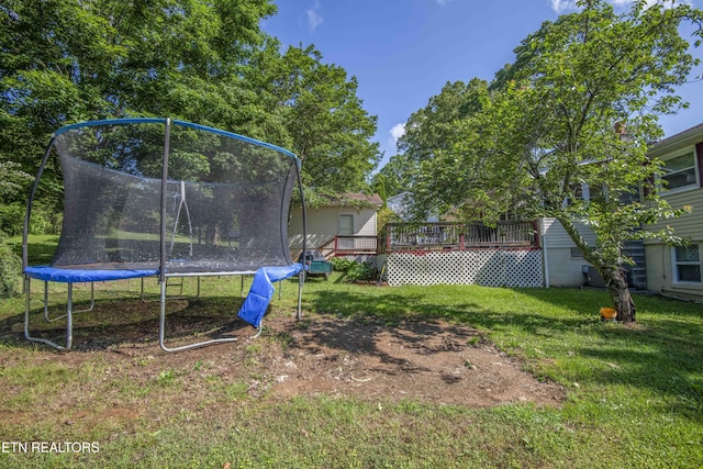 941 Pine Top St, Lenoir City, TN 37772 - view of yard featuring a wooden deck and a trampoline