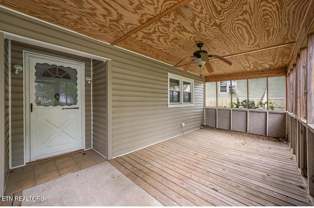 exterior space with ceiling fan