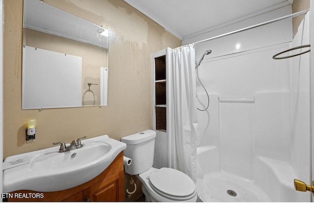 full bathroom featuring crown molding, vanity, a shower stall, and toilet