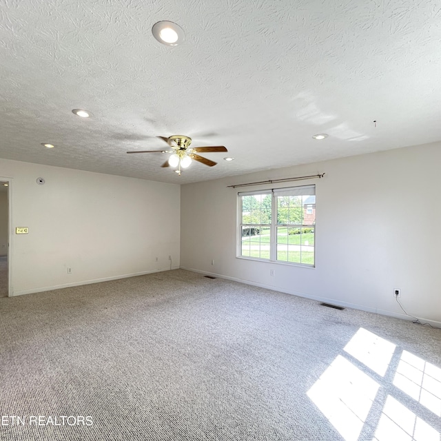 1533 Kildee Ln, Sevierville, TN 37862 - spare room featuring ceiling fan, carpet flooring, recessed lighting, a textured ceiling, and baseboards
