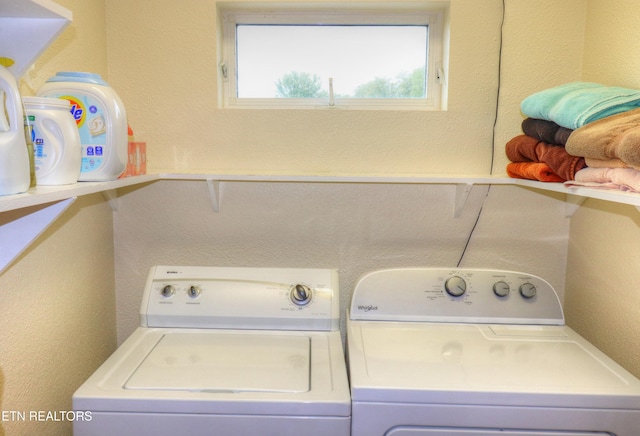 clothes washing area featuring washer and clothes dryer
