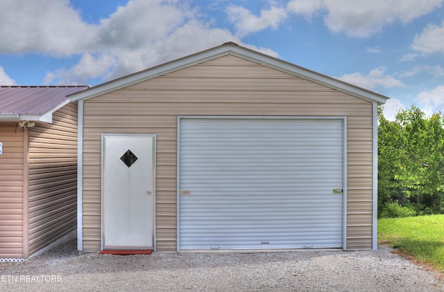 detached garage featuring driveway