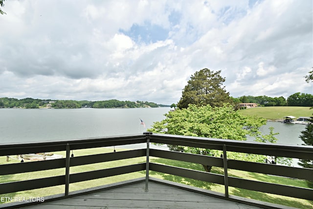 wooden deck with a water view