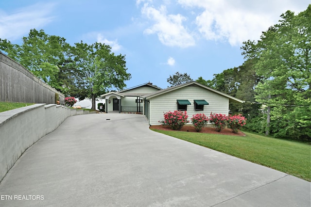 ranch-style home with concrete driveway