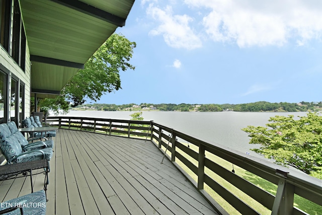 deck featuring a water view