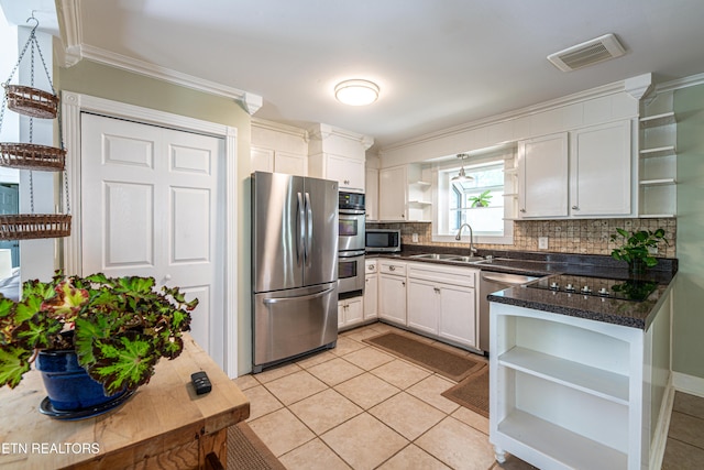 kitchen with a sink, stainless steel appliances, and open shelves